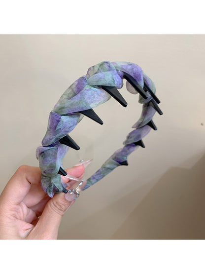 Gifty dainty floral print headband folded to show its lightweight and comfortable fit