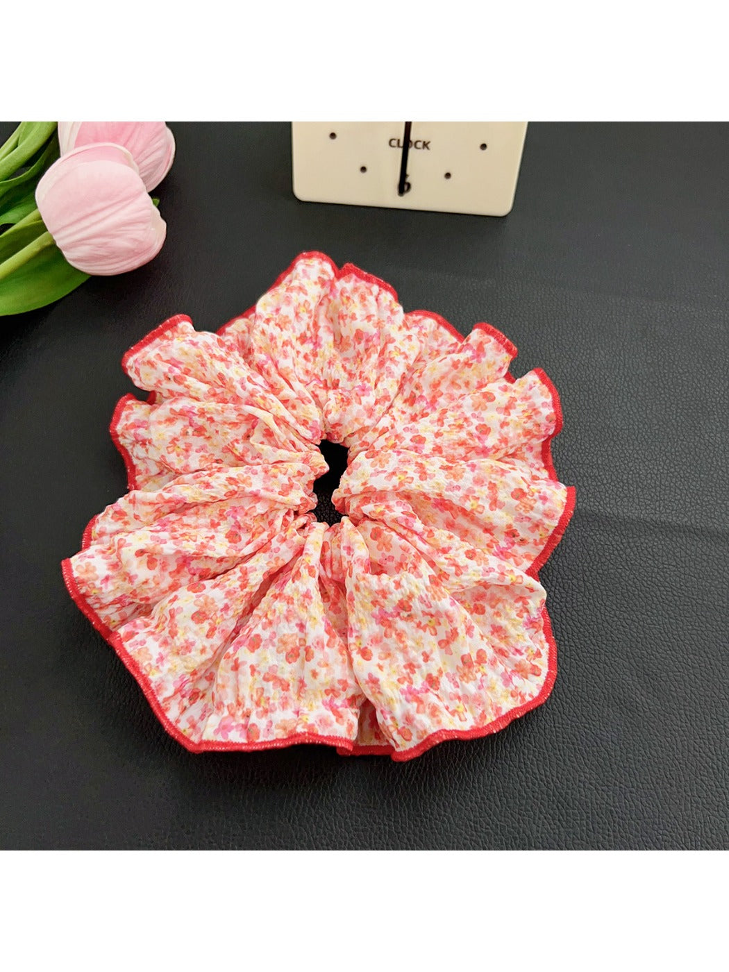 Black and white polka dot scrunchie in a gift packaging box