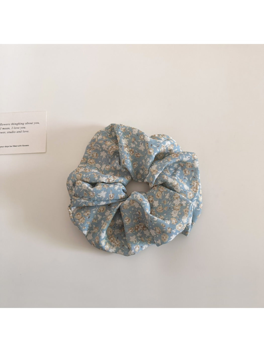 Gifty scrunchie packaged in a clear bag with branding visible