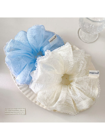 Gifty solid color ruched scrunchie in pastel pink on white background