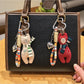Close-up of vintage bear pendant keychain with detailed engraving on metal surface