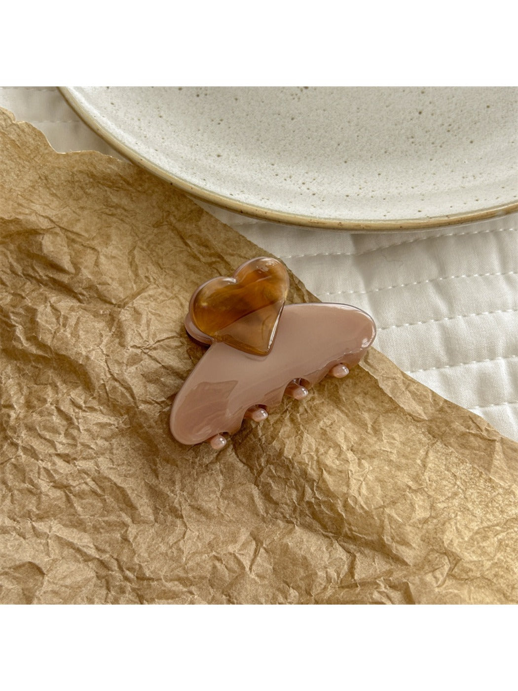 Beau heart shaped acetate claw clip open to reveal inner clasp and hinge details