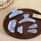 Side view of Beau gentle blue hair clip highlighting clasp mechanism