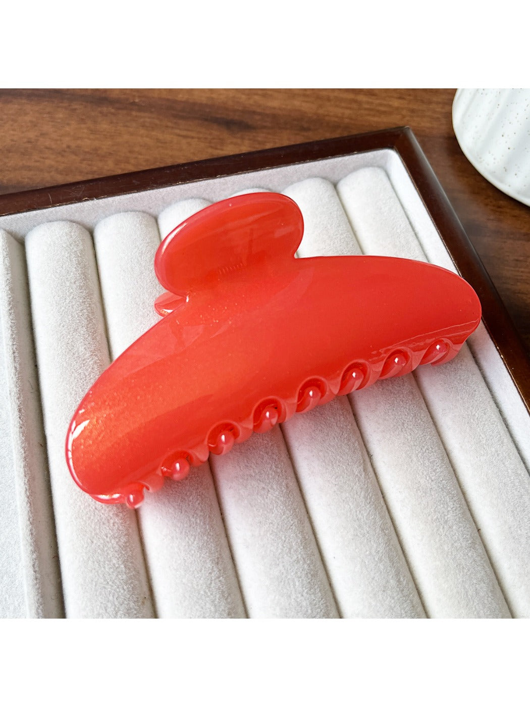 Beau hair clip shown with natural light emphasizing matte texture