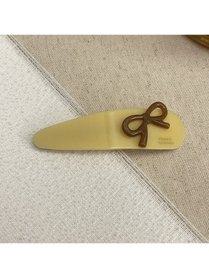 Beau - Bow Embellished Oval Hair Clip