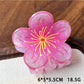Beau floral claw clip displayed with soft lighting highlighting texture and colors
