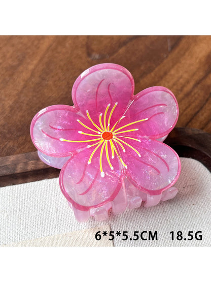 Beau floral claw clip displayed with soft lighting highlighting texture and colors