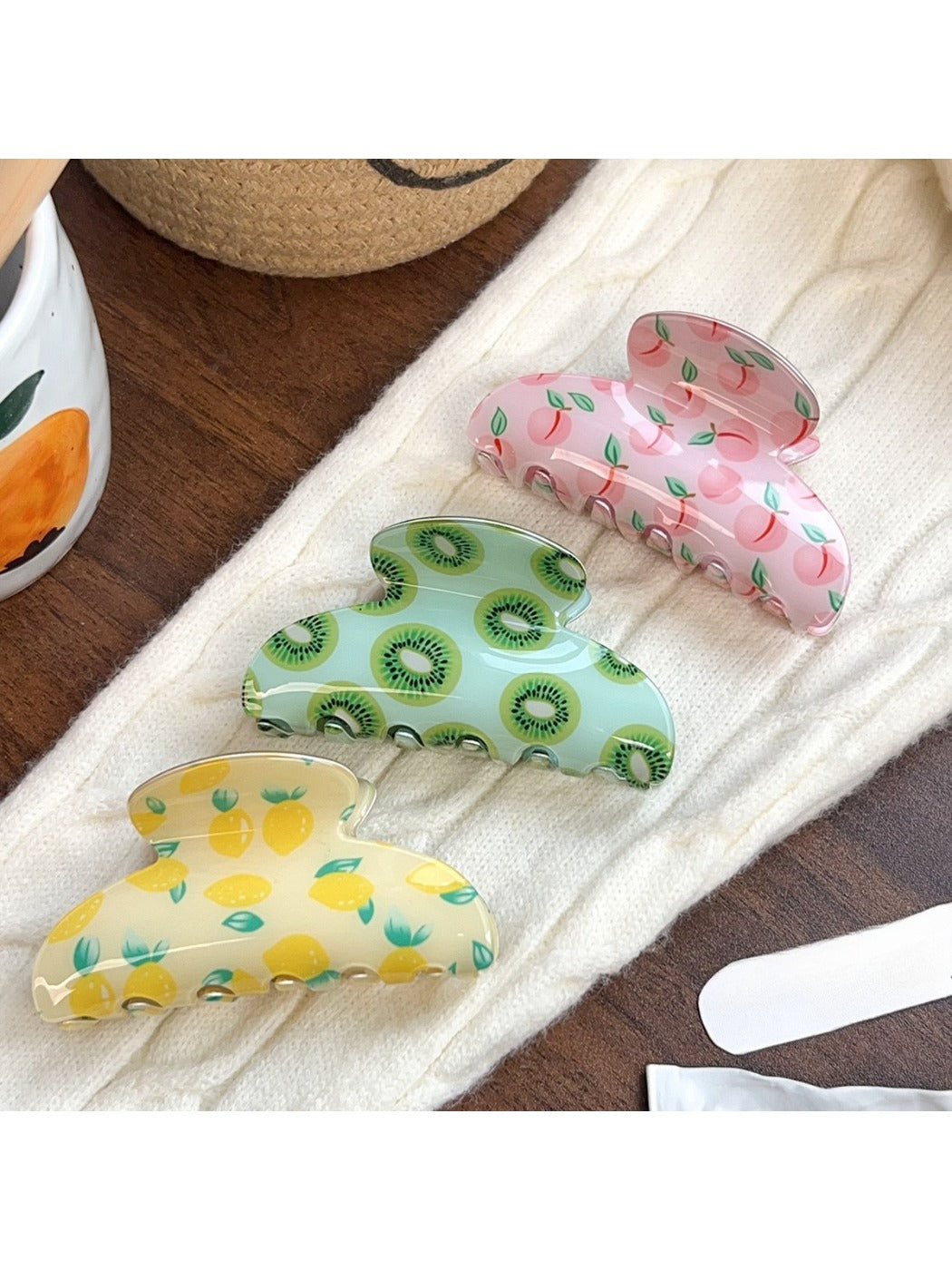 Close-up of Beau fruit print hair claw clip showing detailed design