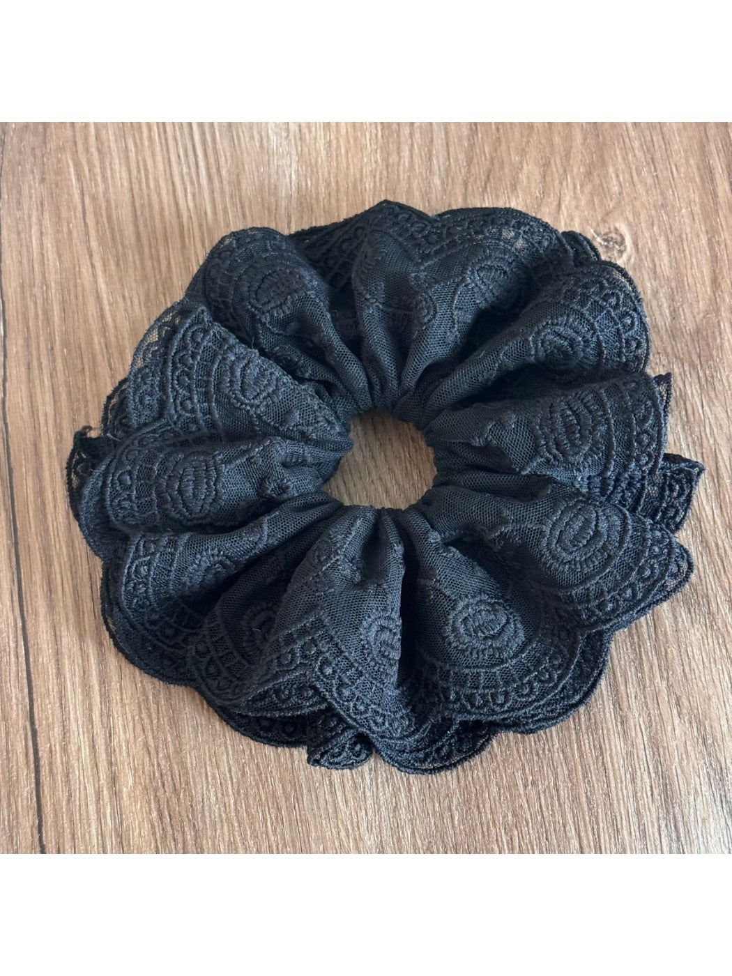 Top view of Gifty lace scrunchie highlighting intricate lace details