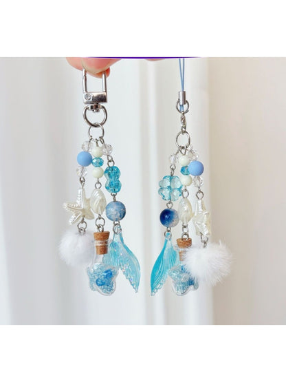 Blue Drift Bottle keychain with a cork stopper and attached metal keyring