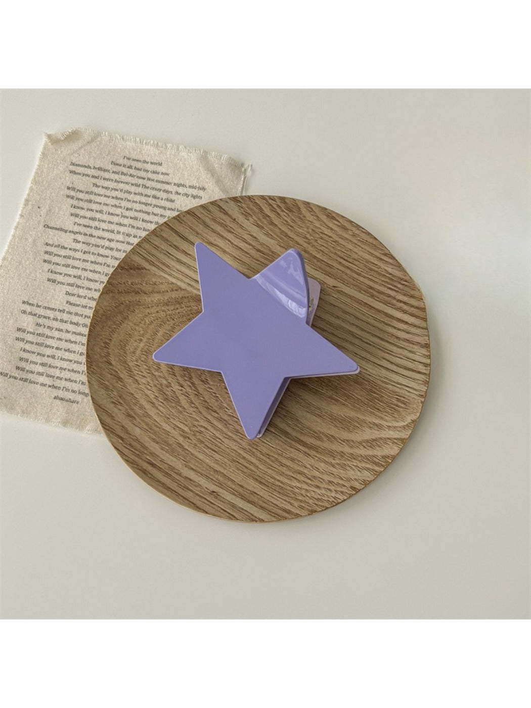 Beau star shaped claw clip in natural light highlighting texture