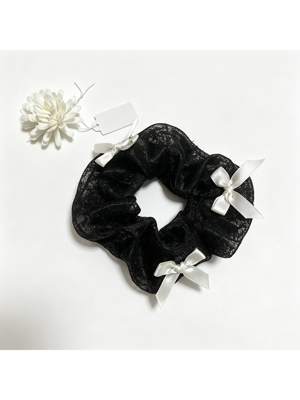 Side view of Gifty satin bow lace scrunchie showing texture and details