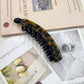 Beau - Curved Mottled Banana Hair Clip