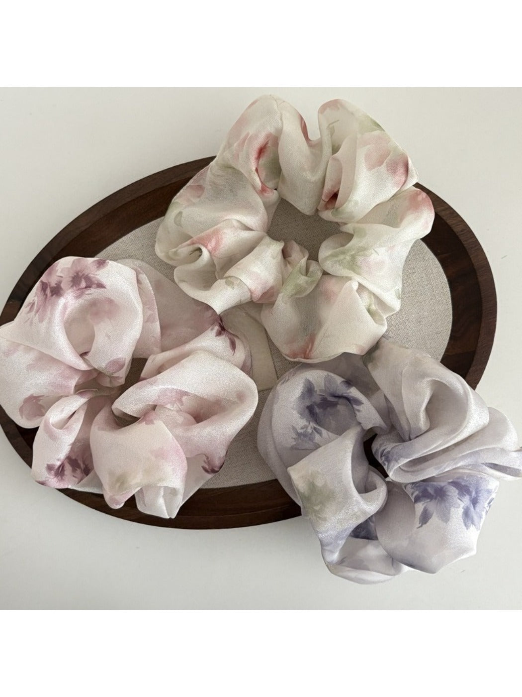 Side view of Gifty fashionable satin scrunchie highlighting fabric texture and pattern
