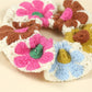 Scrunchie wrapped around a ponytail on a model with long brown hair