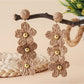 Earedge raffia drop earrings photographed with natural light and shadows