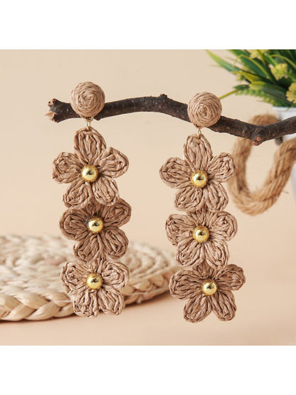 Earedge raffia drop earrings photographed with natural light and shadows