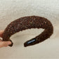 Gifty headband styled with a formal outfit on a mannequin