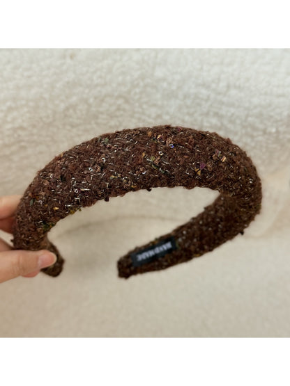 Gifty headband styled with a formal outfit on a mannequin