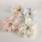 Close-up of Gifty Sweet Graceful Floral Scrunchie with pink and white floral pattern