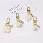 Close-up of Keypus trendy beaded bow charm keychain with colorful beads and gold ring