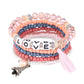 Lovra bracelet with tassel charm laid flat showing bead texture and color variety