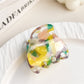 Beau multicolored half moon claw clip showing curved shape