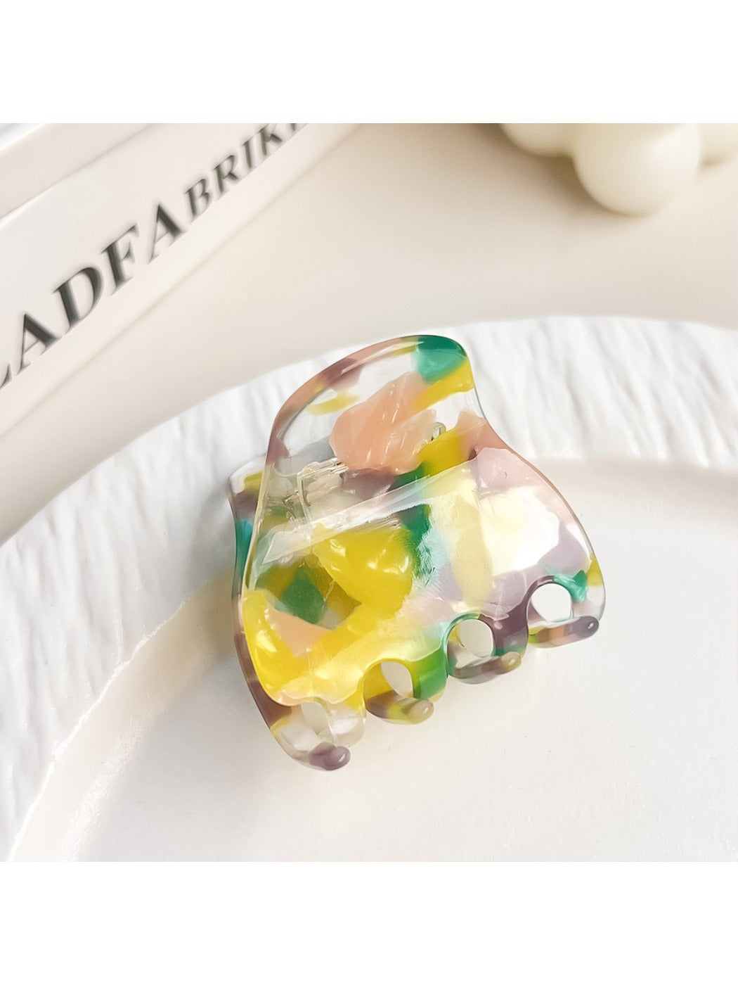 Beau multicolored half moon claw clip showing curved shape