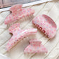 Close-up of Beau Sweet Pink Floral Print Hair Claw Clip showing floral pattern
