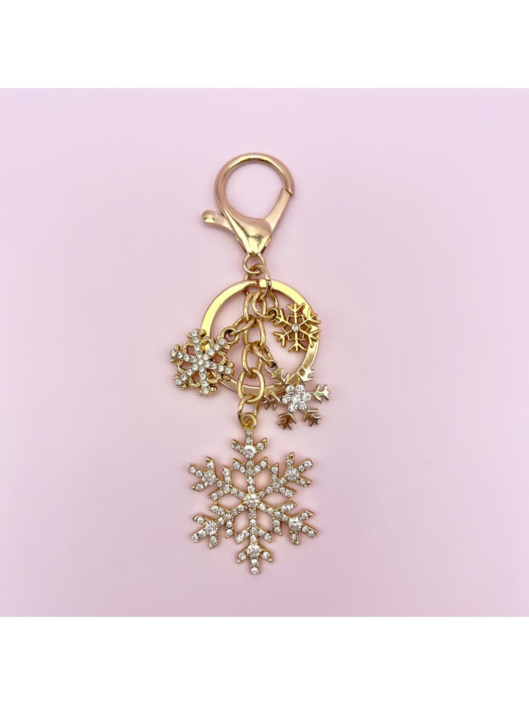 Silver snowflake keychain pendant with detailed symmetrical design