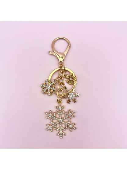 Silver snowflake keychain pendant with detailed symmetrical design
