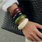Lovra open cuff bracelet displayed on a hand with natural lighting