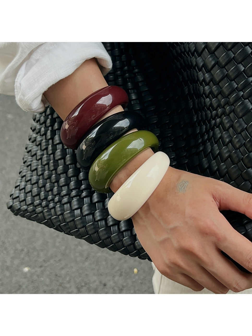Lovra open cuff bracelet displayed on a hand with natural lighting