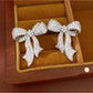 Earedge - Synthetic Zircon Bow Stud Earrings Pair