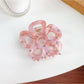 Top view of Beau flower shaped hair claw clip showing symmetrical design
