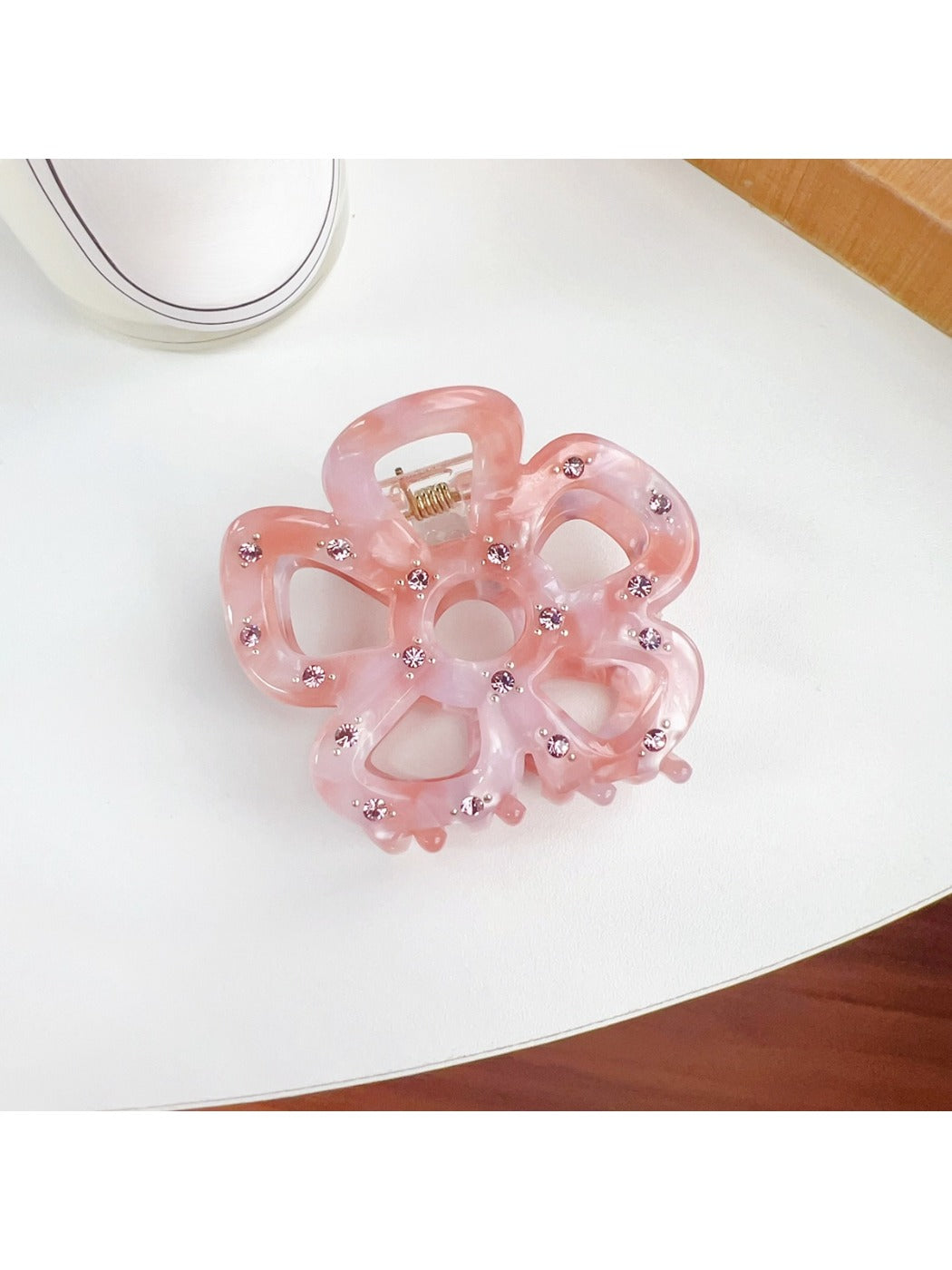 Top view of Beau flower shaped hair claw clip showing symmetrical design