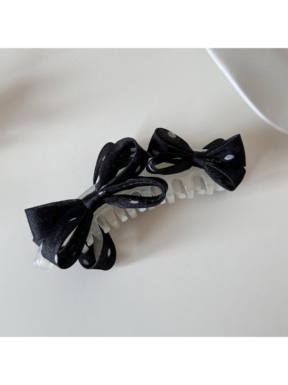 Back view of Beau polka dot bow banana clip showing clasp mechanism