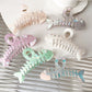 Side view of Beau fishbone shaped acetate hair clip highlighting clip mechanism