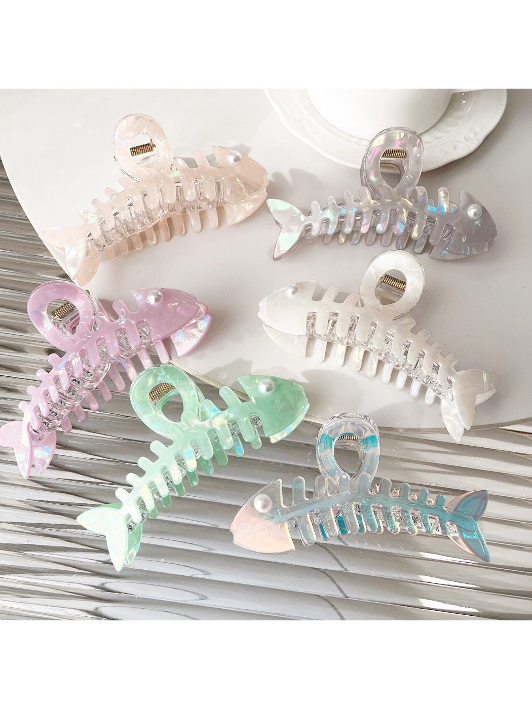 Side view of Beau fishbone shaped acetate hair clip highlighting clip mechanism