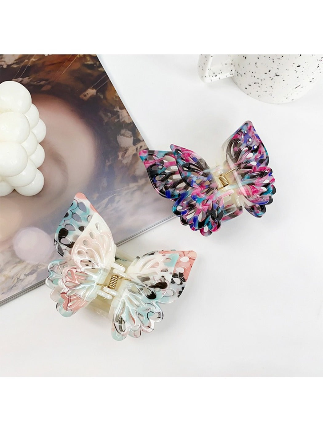 Close-up of Beau double layer hollow bow shaped claw clip showing clip mechanism