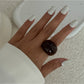 Lovra open cuff bracelet and ring shown with soft shadows on white background