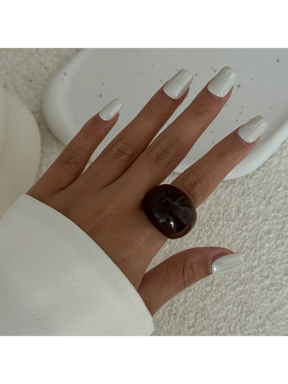 Lovra open cuff bracelet and ring shown with soft shadows on white background