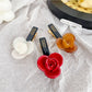 Beau floral hair clip displayed on a white background showing metal clip detail