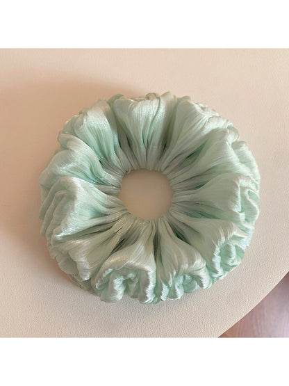 Sweet green double layered scrunchie with soft fabric texture
