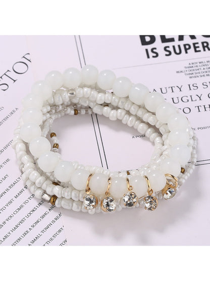 Lovra bracelet showing detailed colorful beads and sparkling rhinestone pendant