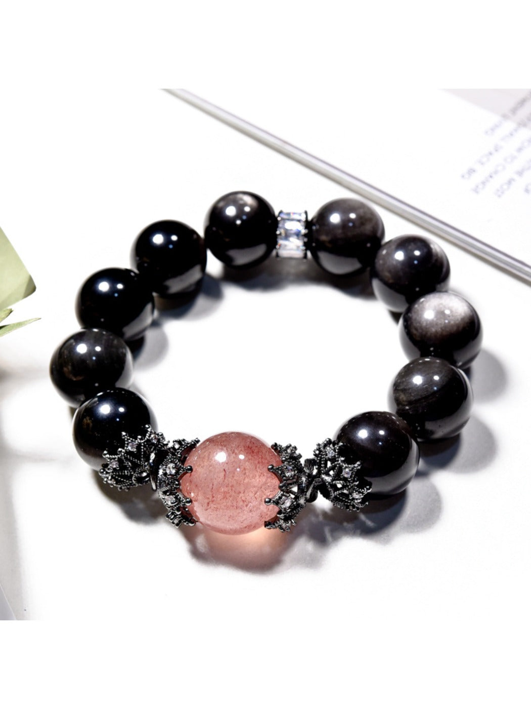 Lovra black crystal beaded bracelet displayed on a wooden surface