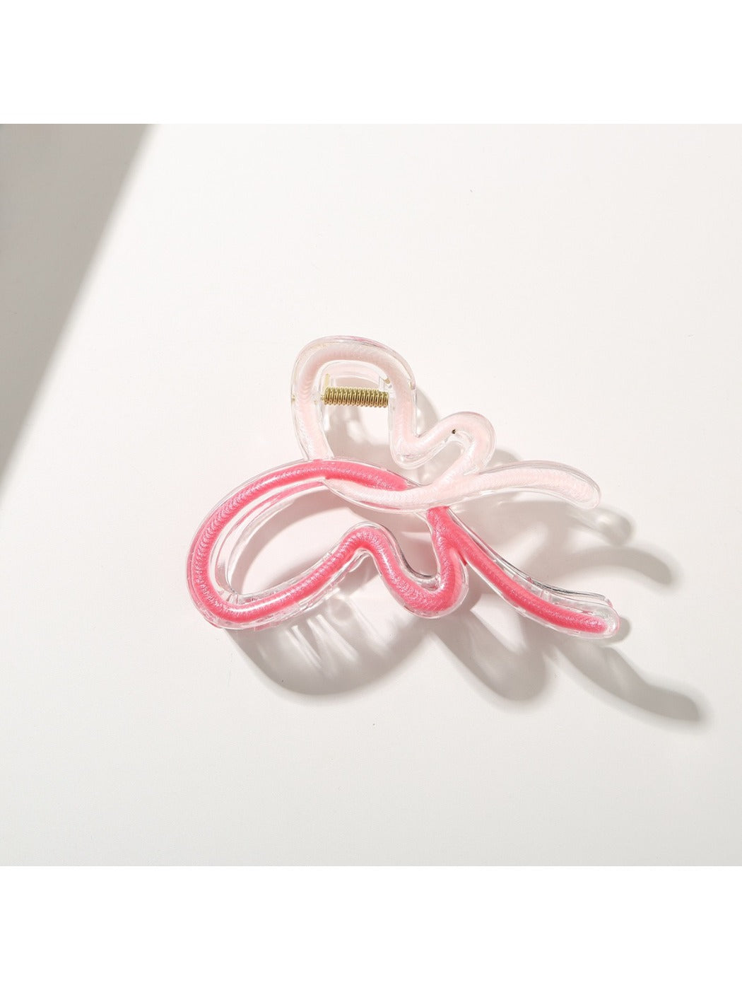 Beau butterfly hair clip held in hand showing size and shape