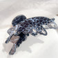 Beau leopard print butterfly claw clip displayed with packaging