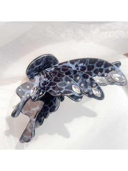 Beau leopard print butterfly claw clip displayed with packaging