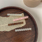 Close-up of Beau chic small square hair clip showing smooth surface and edges